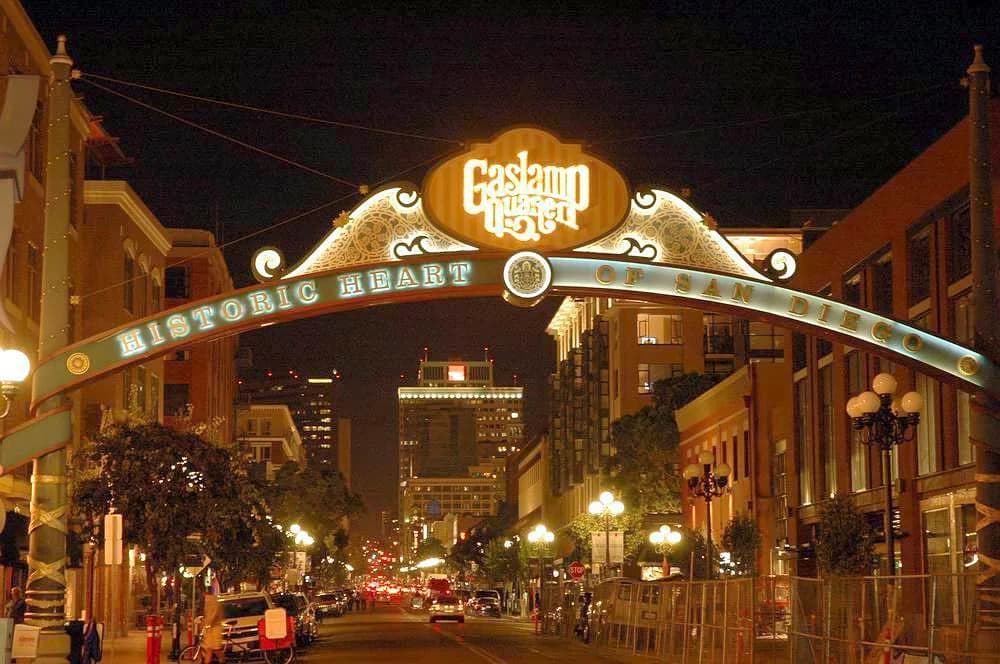 The illuminated Gaslamp Quarter arch above Fifth Avenue.