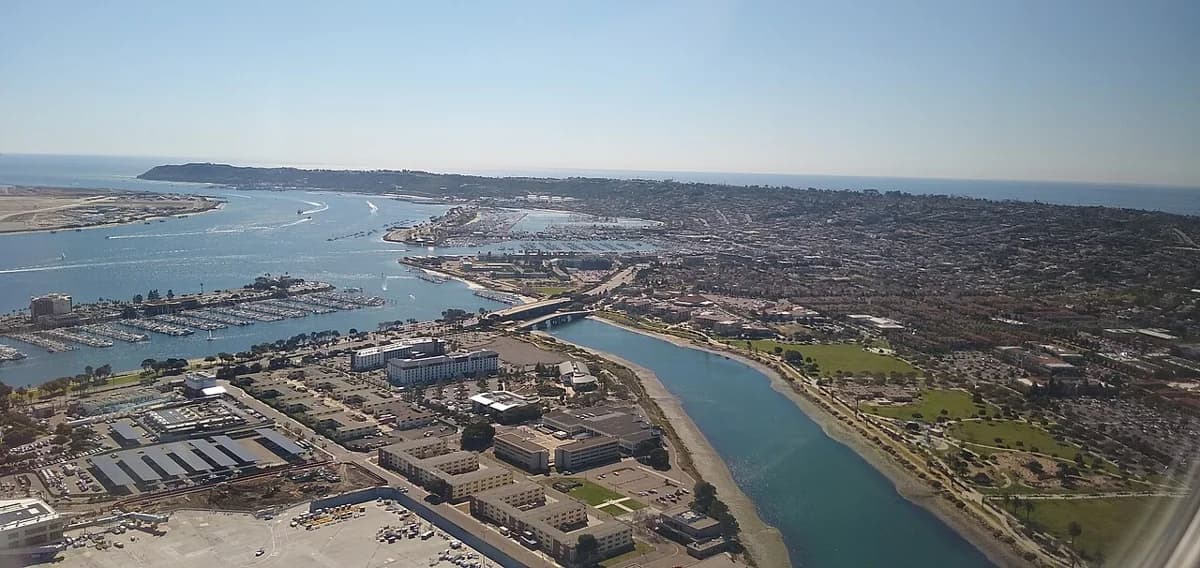 An aerial view of Liberty Station, its park, and the nearby airport.